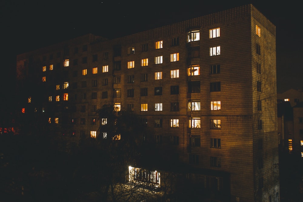 brown high-rise buildings during night time
