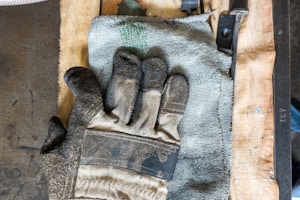 white and gray gloves on towel