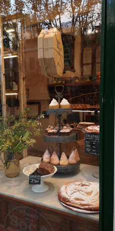 A warm bakery storefront in Saltillo with colorful pastries displayed invitingly.