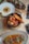 A beautifully arranged table featuring gourmet dishes seasoned with salt.