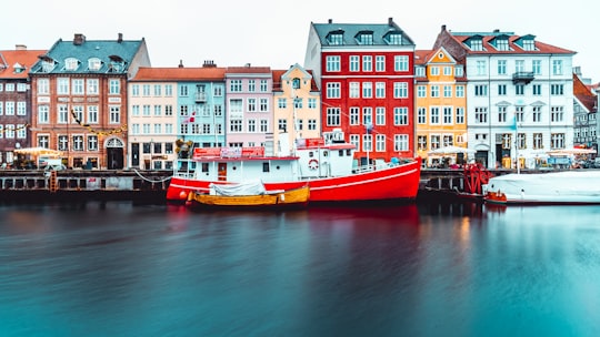 boat beside dock in Nyhavn Denmark