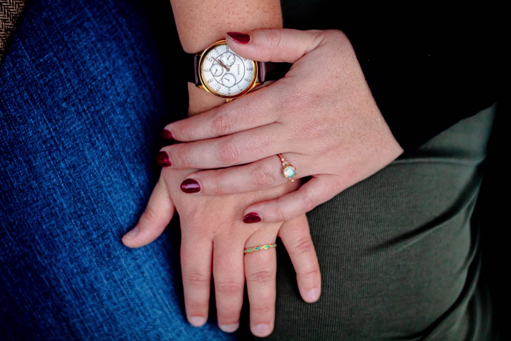 round gold-colored chronograph watch