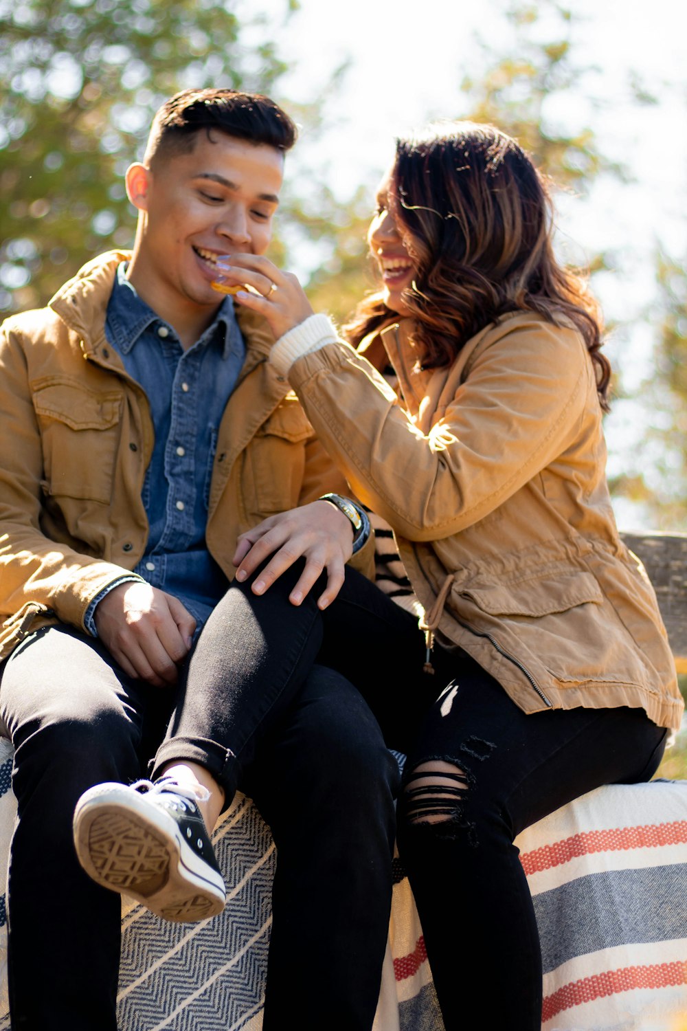couple wearing brown button-up jacket