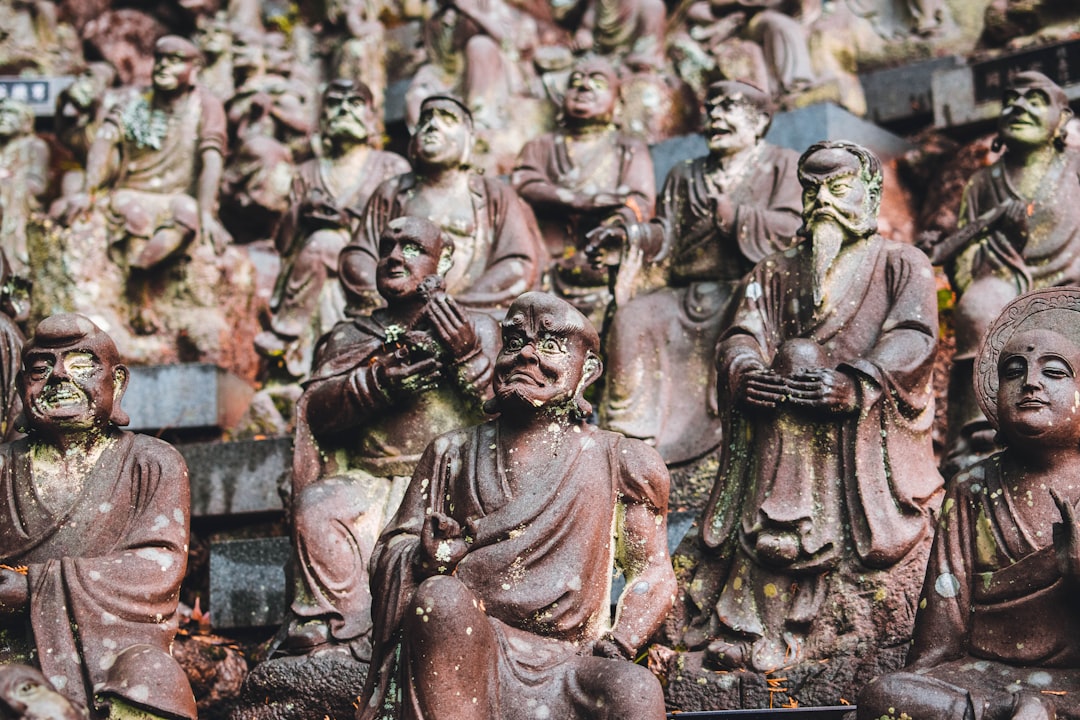 grayscale photo of people statues