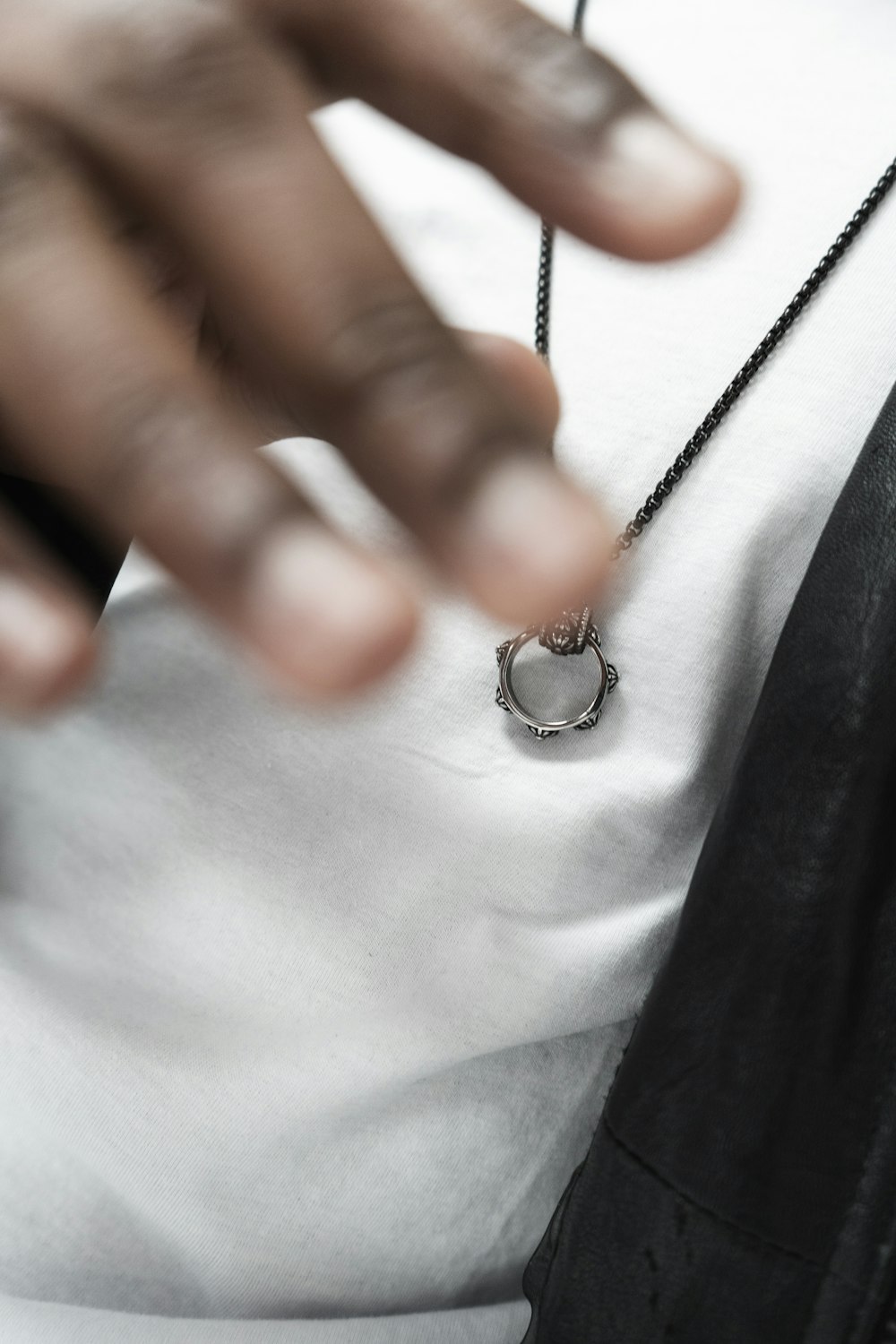 silver-colored pendant necklace