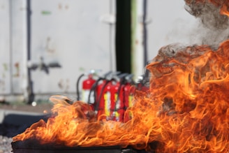 red fire extinguishers with fire