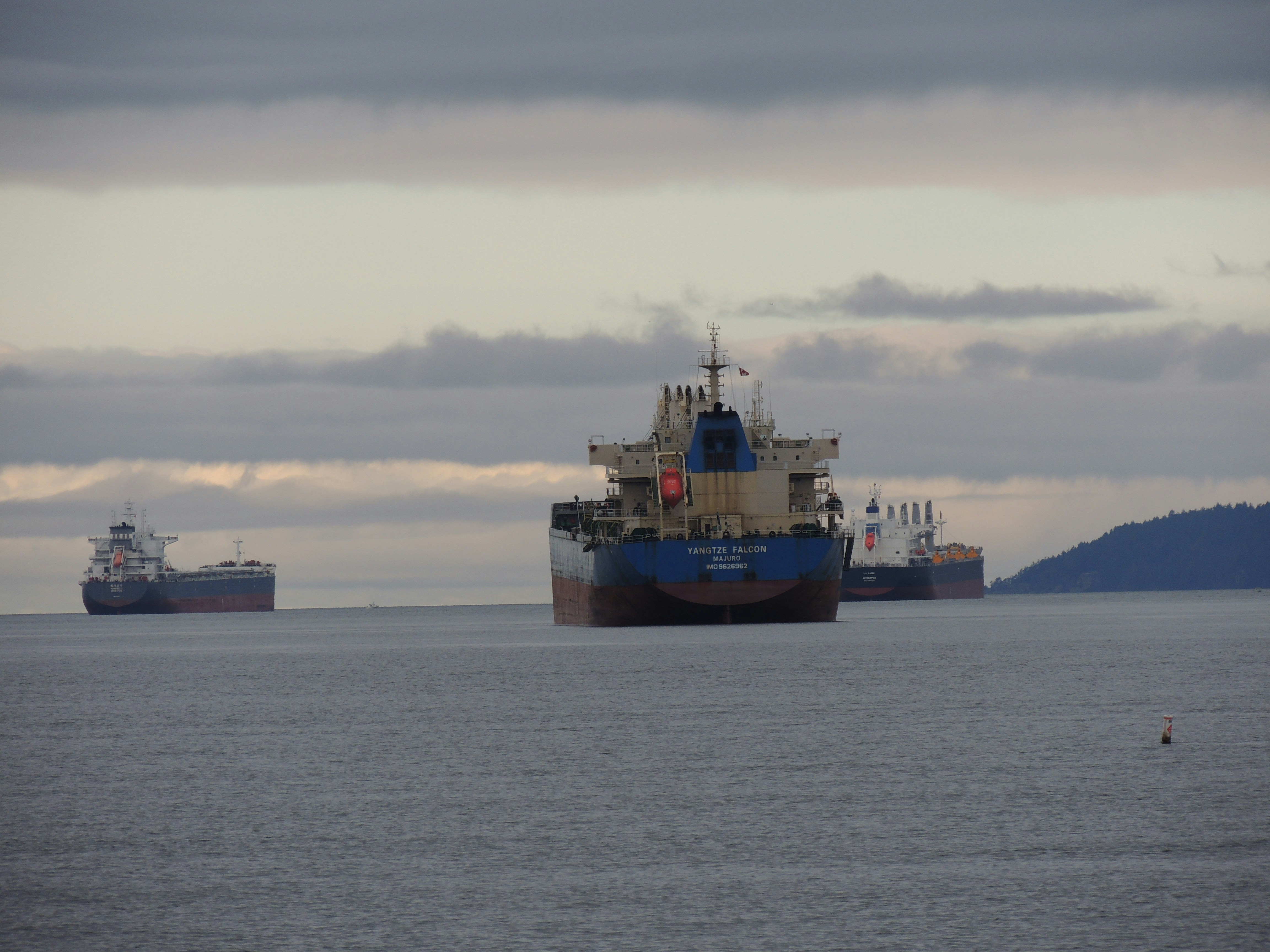 Large cargo ship navigating through ocean waters