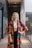 woman in multicolored foliage quarter-sleeved robe