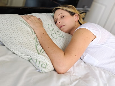 A calm patient resting peacefully in a softly lit clinical room emphasizing sleep health.