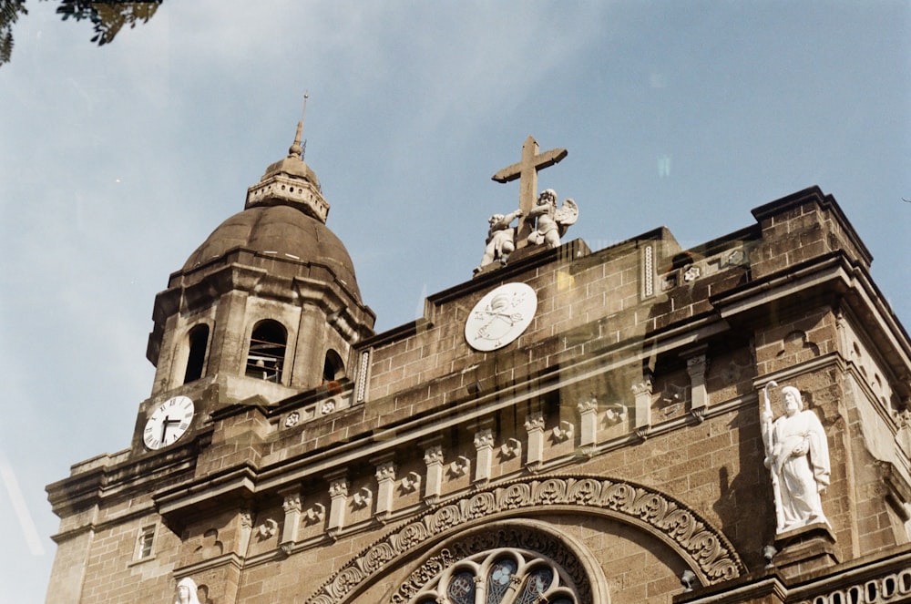 low-angle photography of brown concrete church building