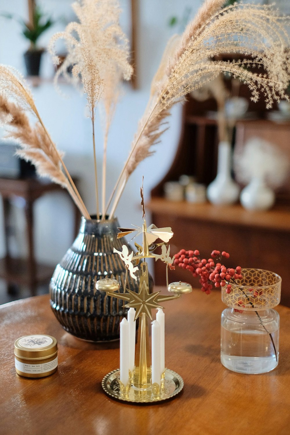 brown and gray flower vase beside glass decors