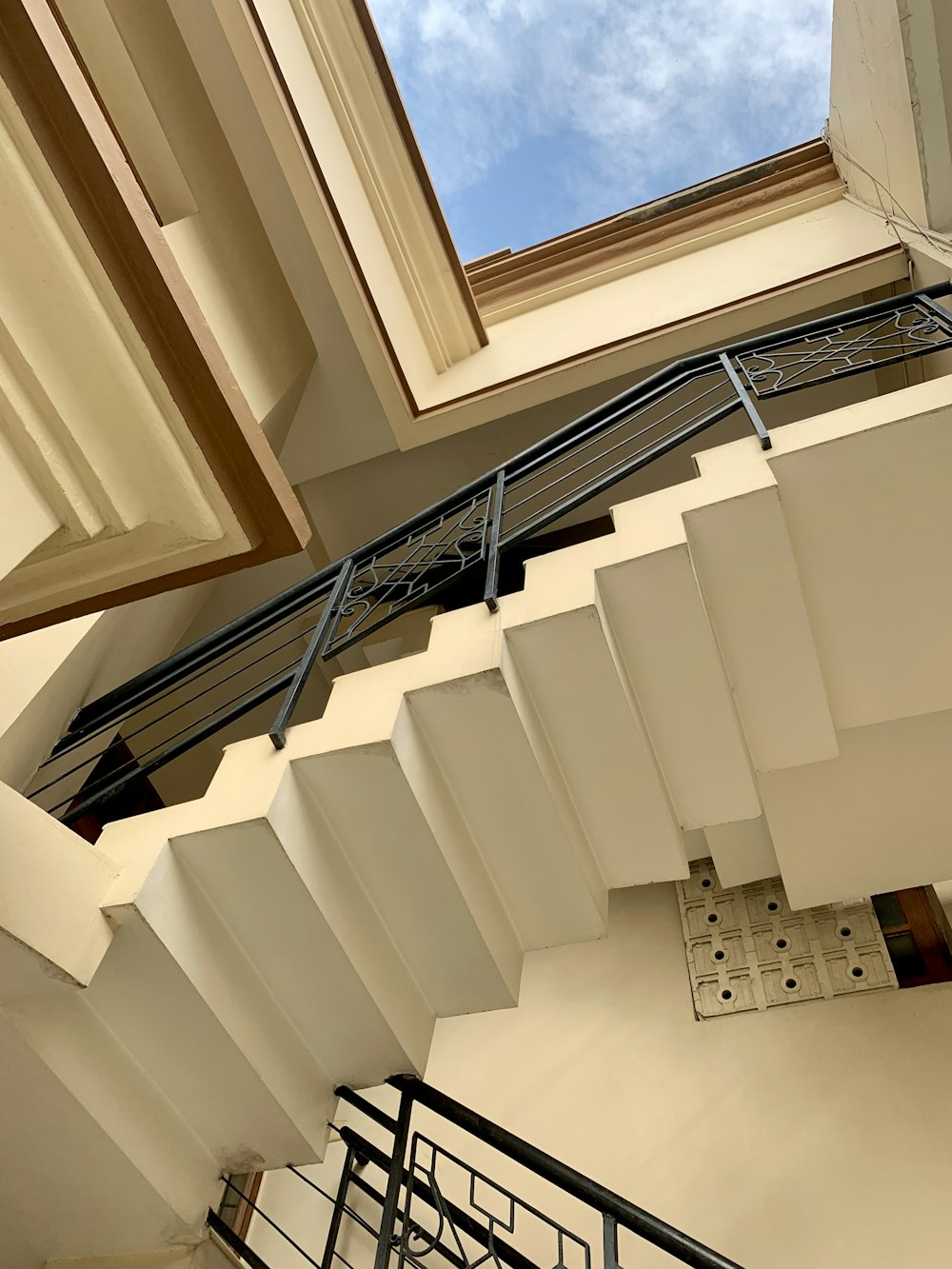 low-angle photography of white concrete stairs