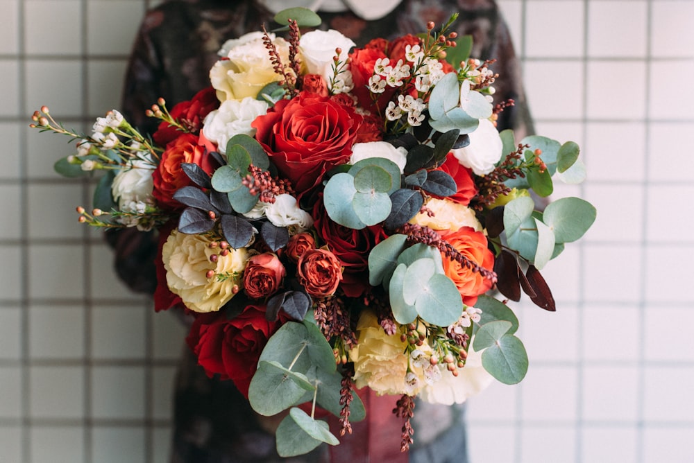 red, white, and green bouquet of flower