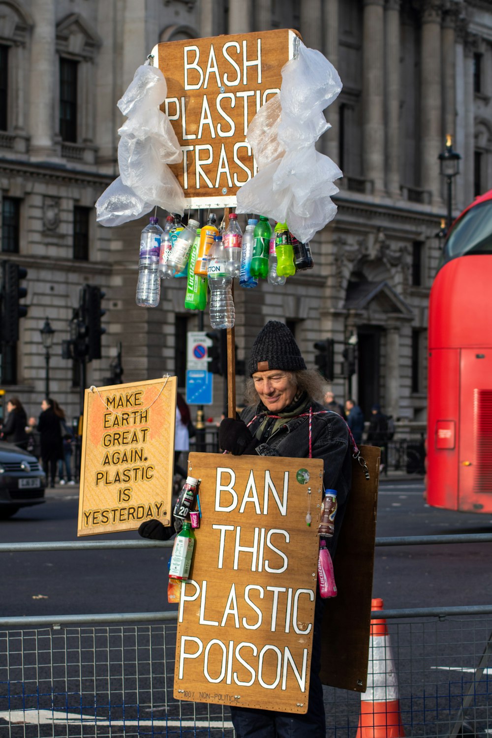 person holding signage near outdoor during daytime