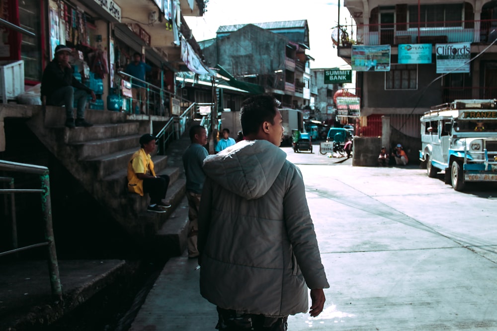 man wearing gray jacket