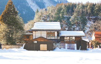 A cozy wooden house in a snowy forest setting, showcasing precise prefab construction.