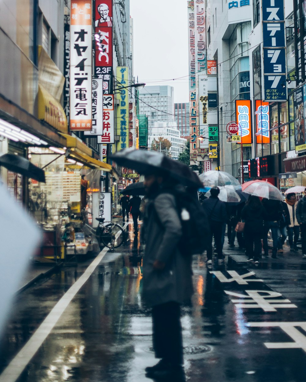 view photography of people walking between buildings during daytime