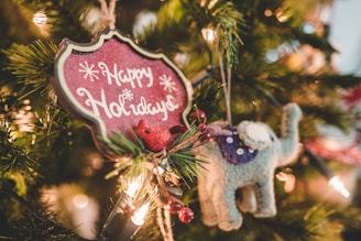 grey elephant Christmas ornament hang on lighted Christmas tree