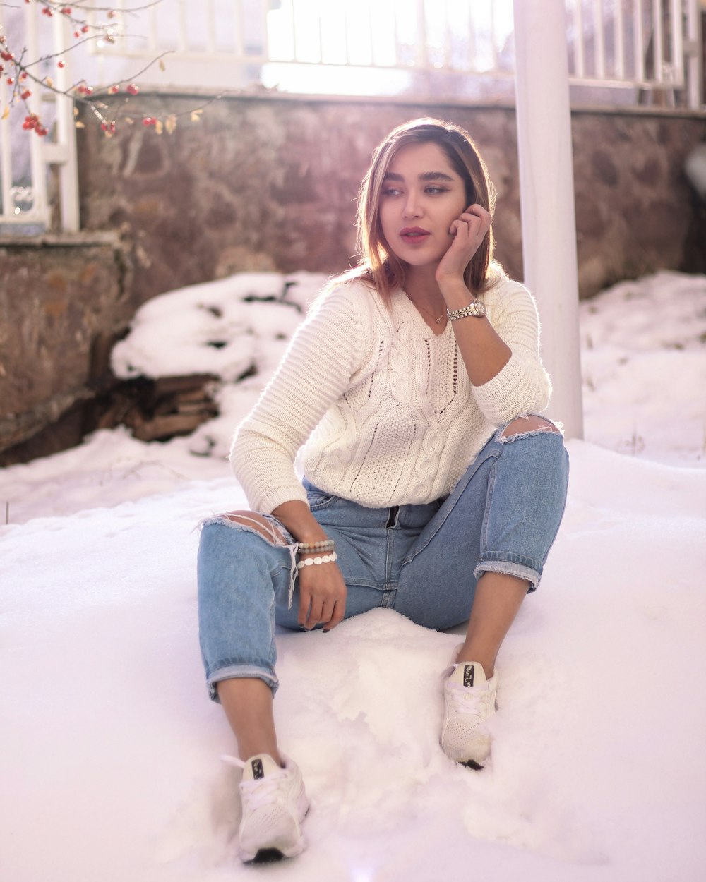 woman sitting on snow