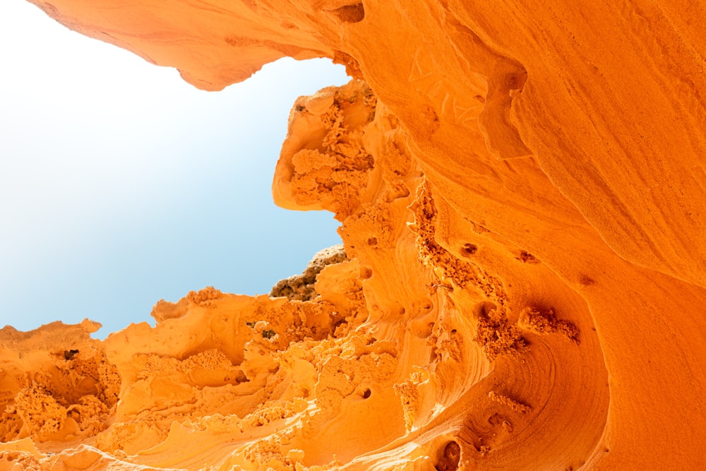 a rock formation with a sky in the background