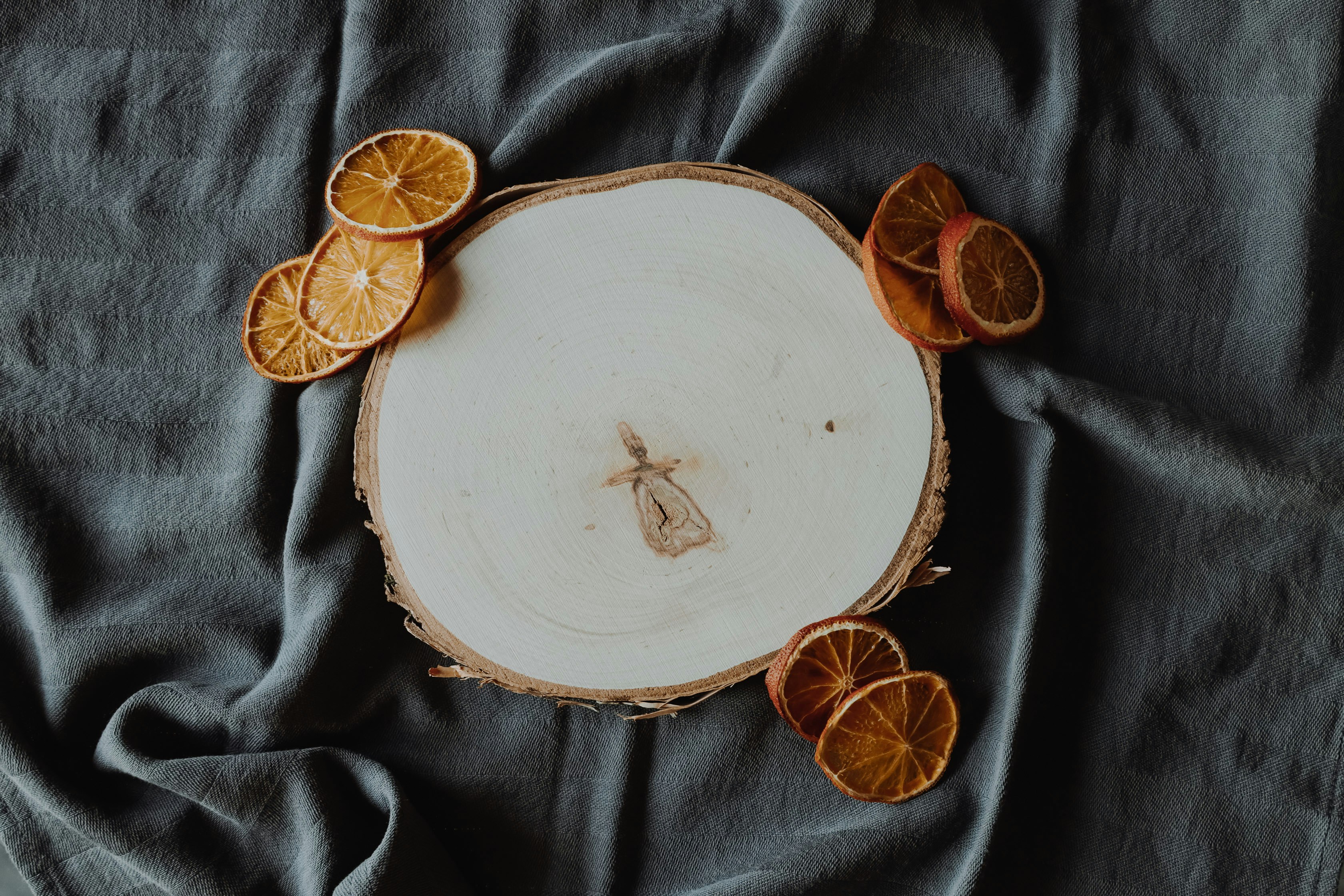 sliced citrus beside ceramic panel