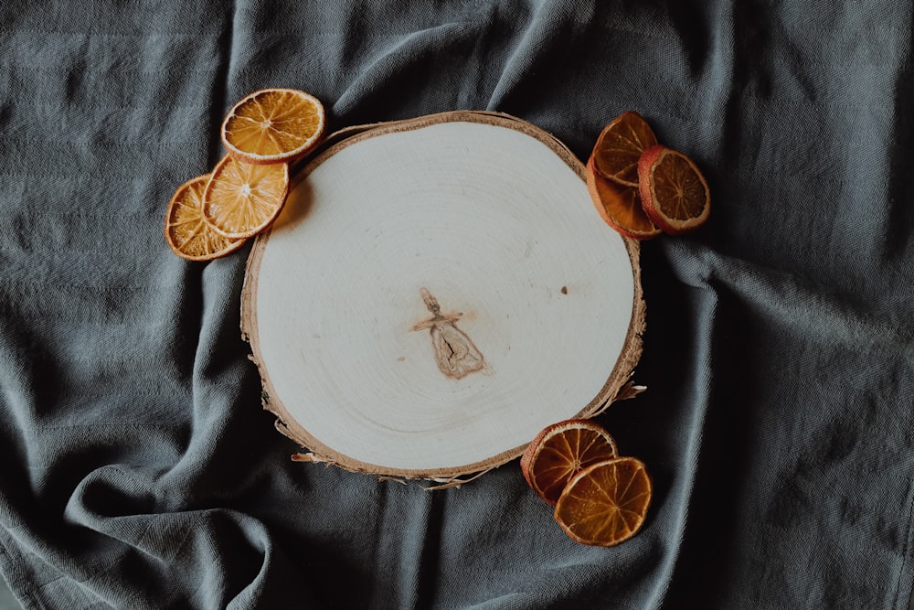 sliced citrus beside ceramic panel