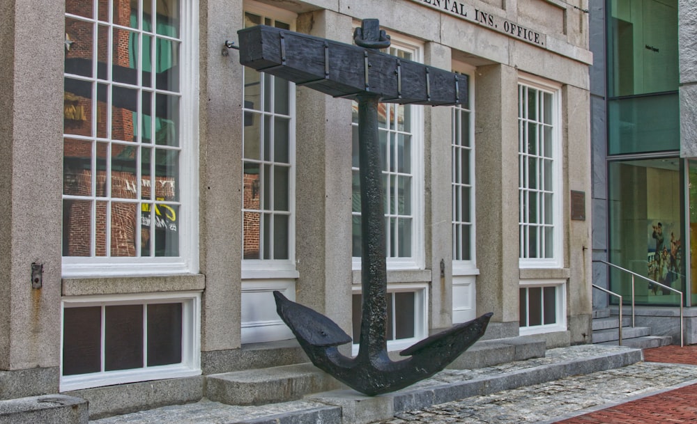 black metal boat anchor statue