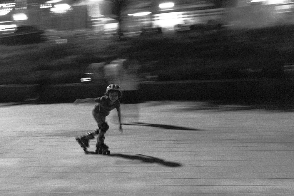 grayscale photo of girl doing skate lines