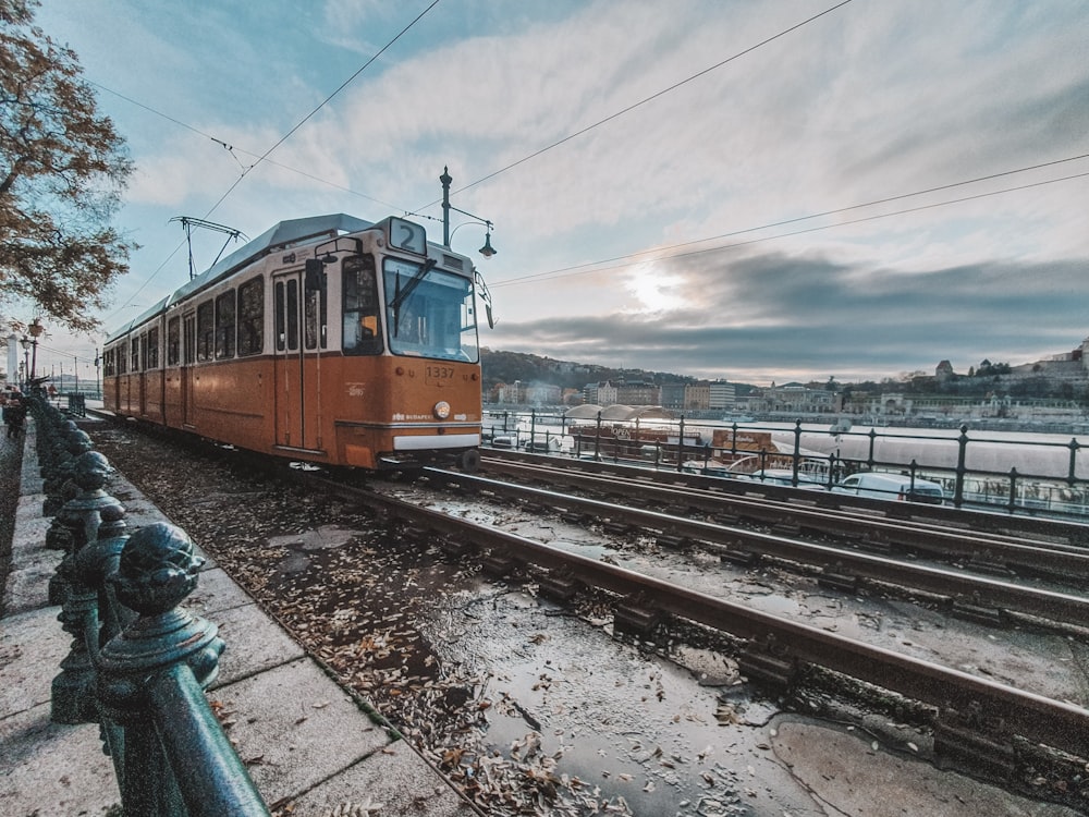 white and red train on a railway