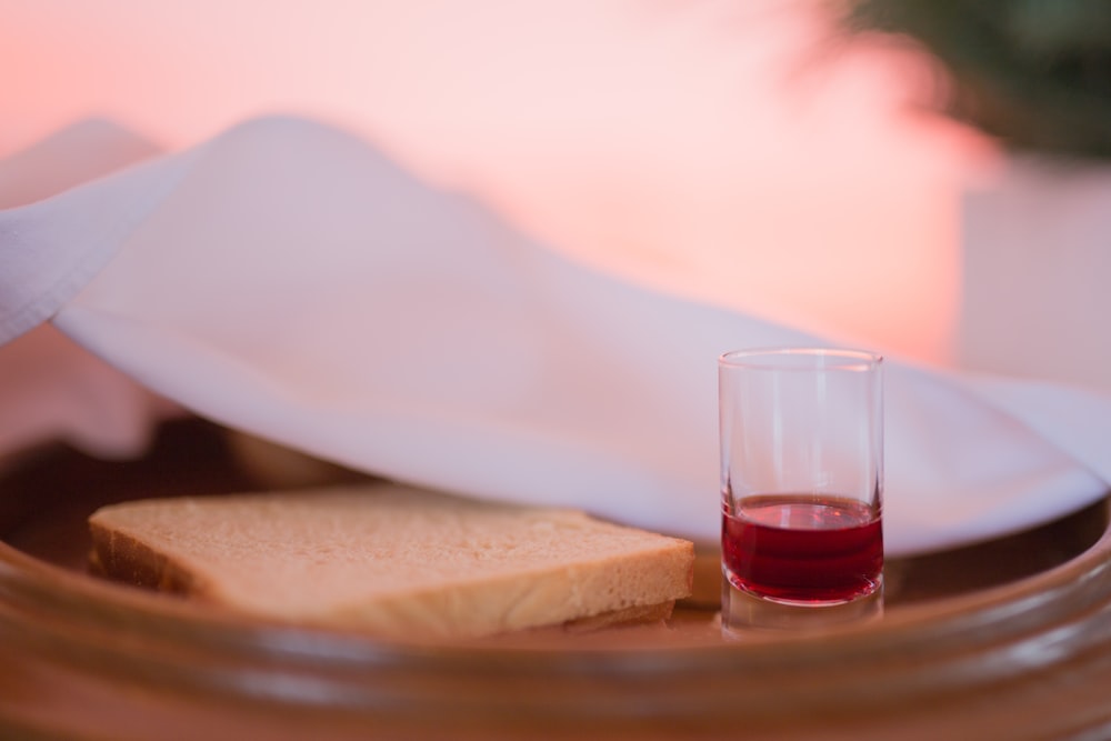 bread beside cup on tray