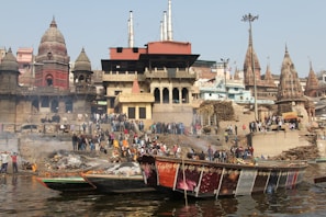 Sunrise over the Ganga ghats with pilgrims performing morning rituals.