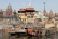 Pilgrims performing rituals at the ghats of Varanasi with the Ganges river glowing in the morning light.