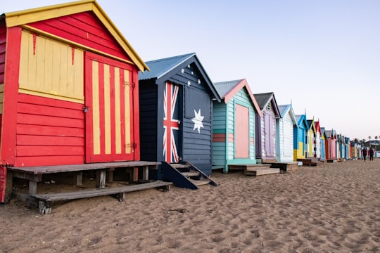 assorted-color houses on shore in Brighton Bathing Boxes Australia