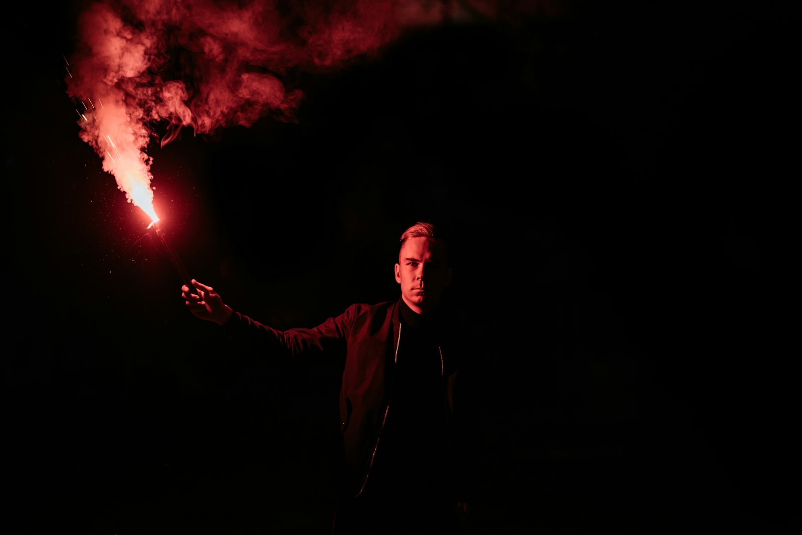 Sony a7 III + ZEISS Batis 85mm F1.8 sample photo. Man holding fireworks photography