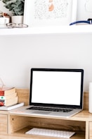 MacBook Pro on brown wooden table