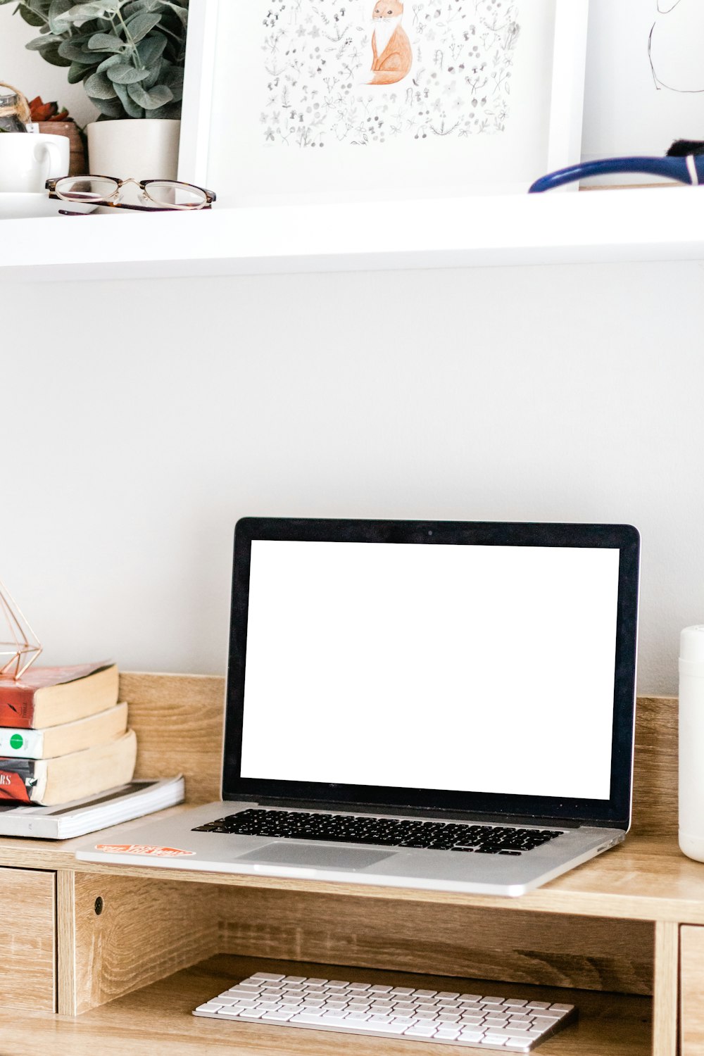 MacBook Pro on brown wooden table