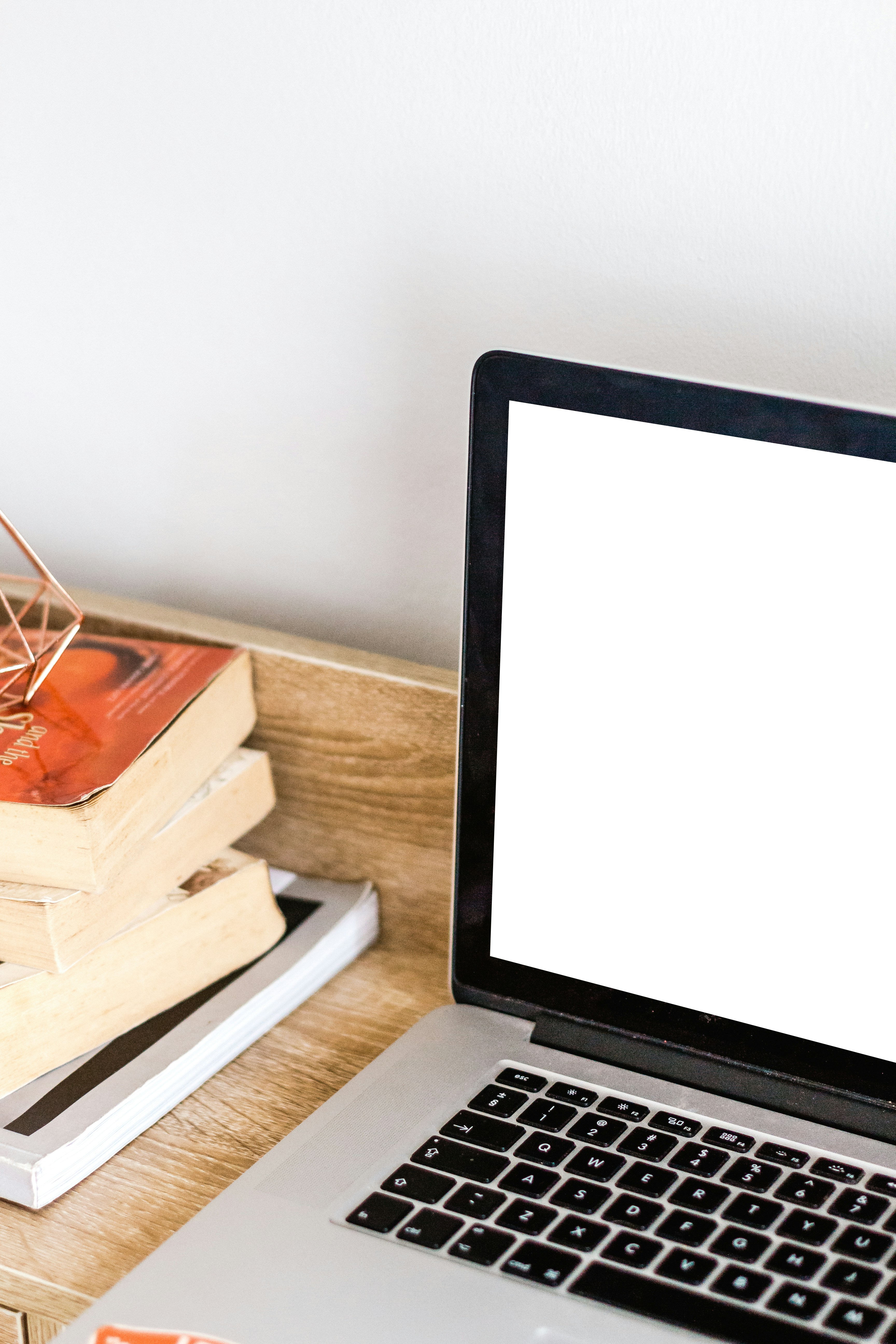 MacBook Pro on brown wooden surface
