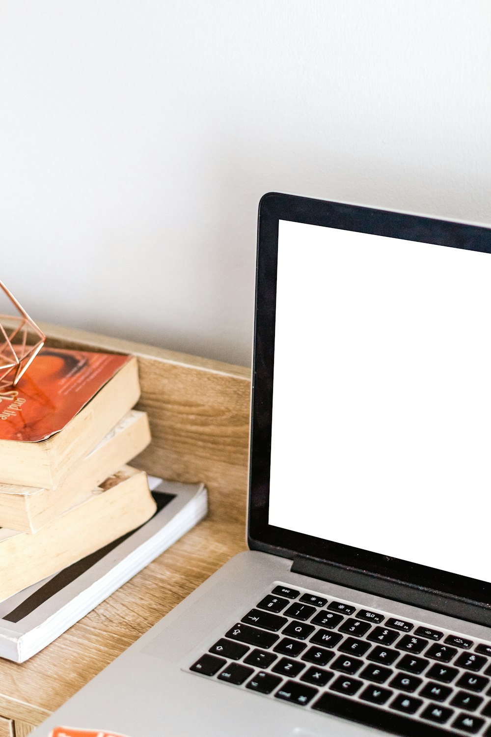 MacBook Pro on brown wooden surface