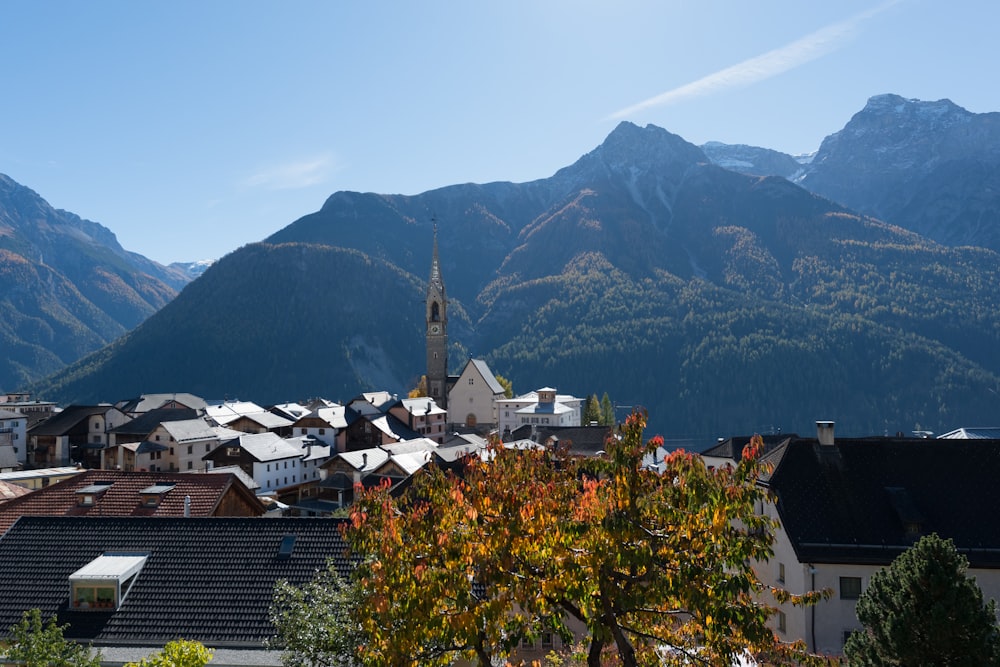 village near mountains at daytime