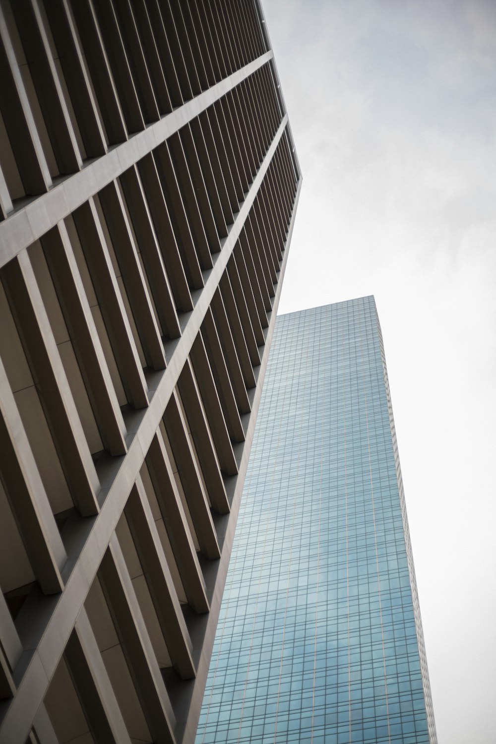 worm view photo of gray building under cloudysky