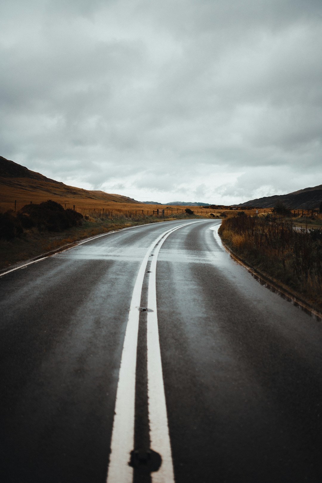 road under cloudy sky