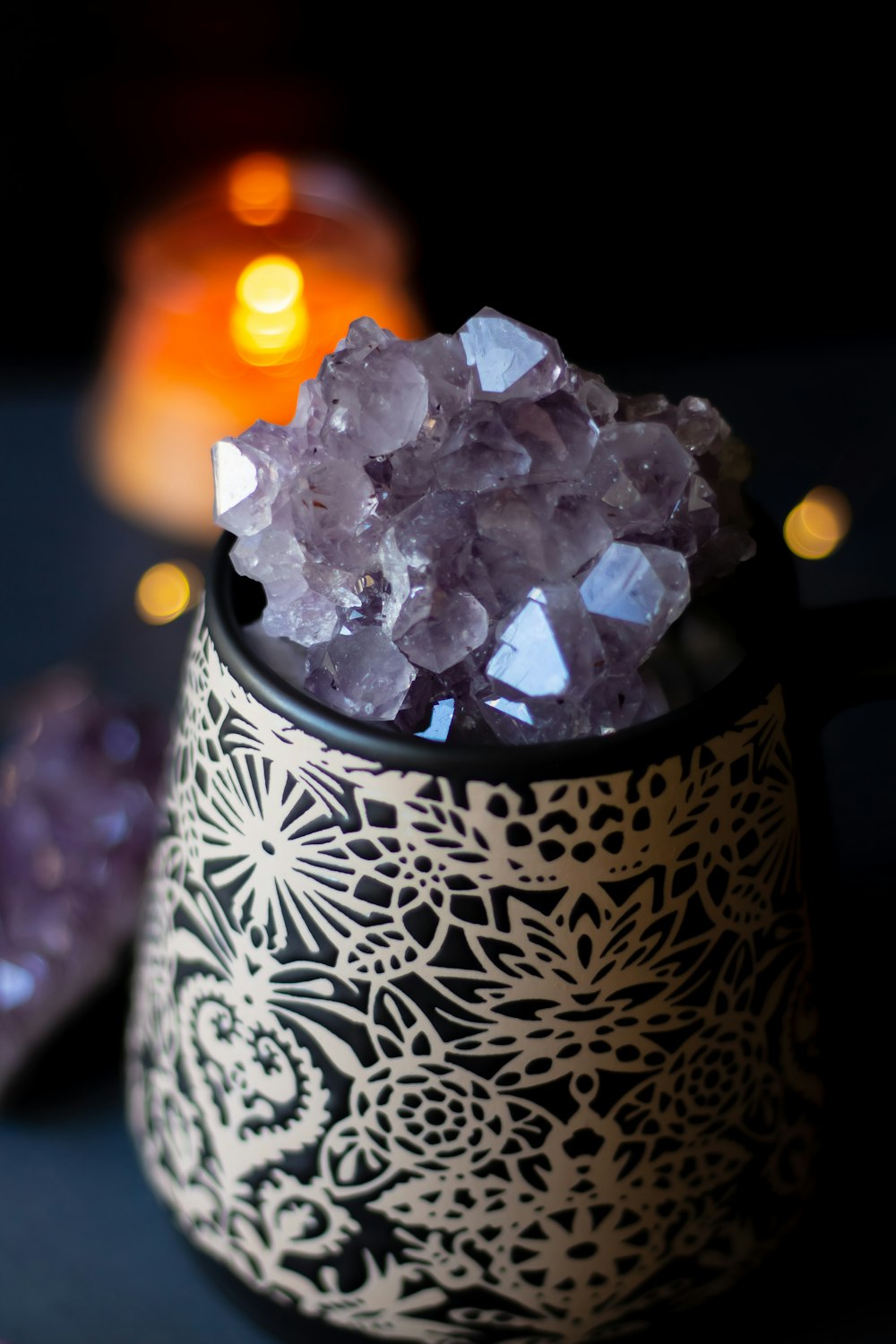 purple quartz on white and black floral container