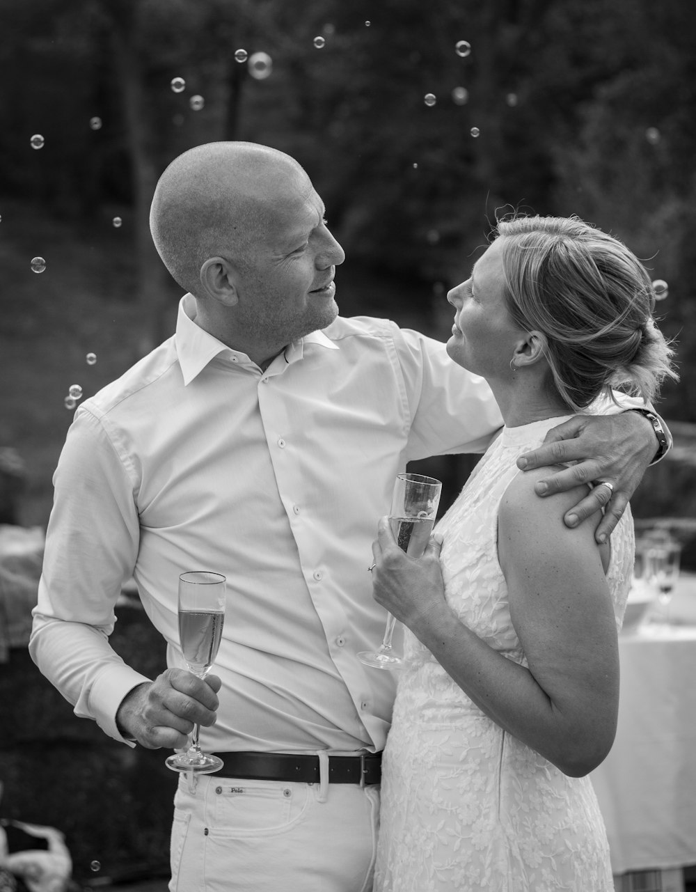 man and woman holding champagne glasses