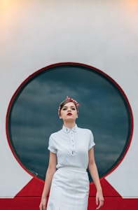 woman wearing white shirt and white skirt
