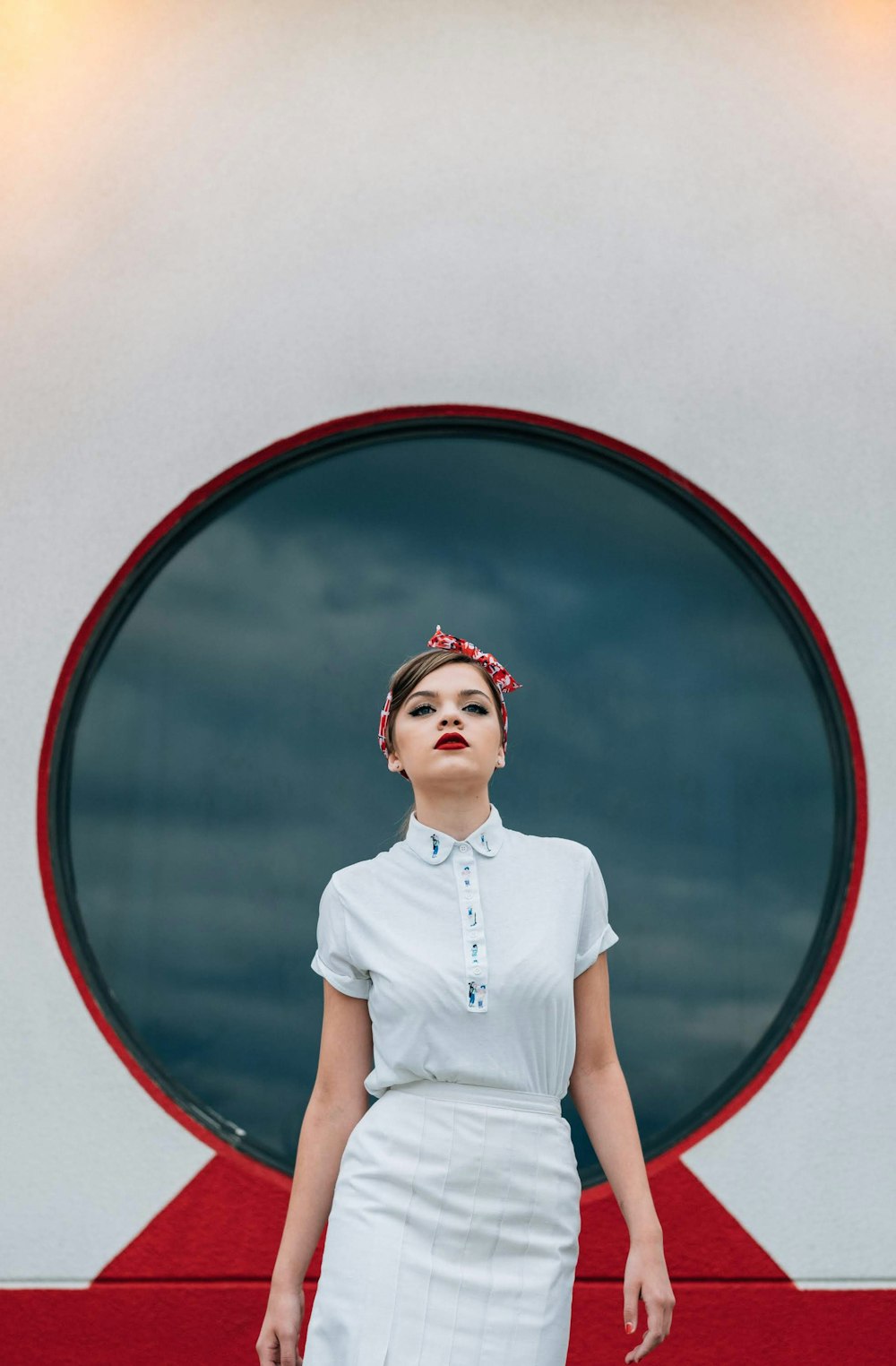 woman wearing white shirt and white skirt