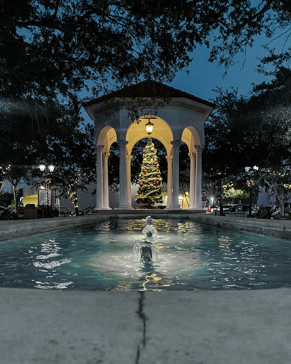 Christmas tree in gazebo near pool
