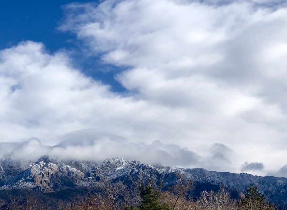 aerial photography of mountain and clouds