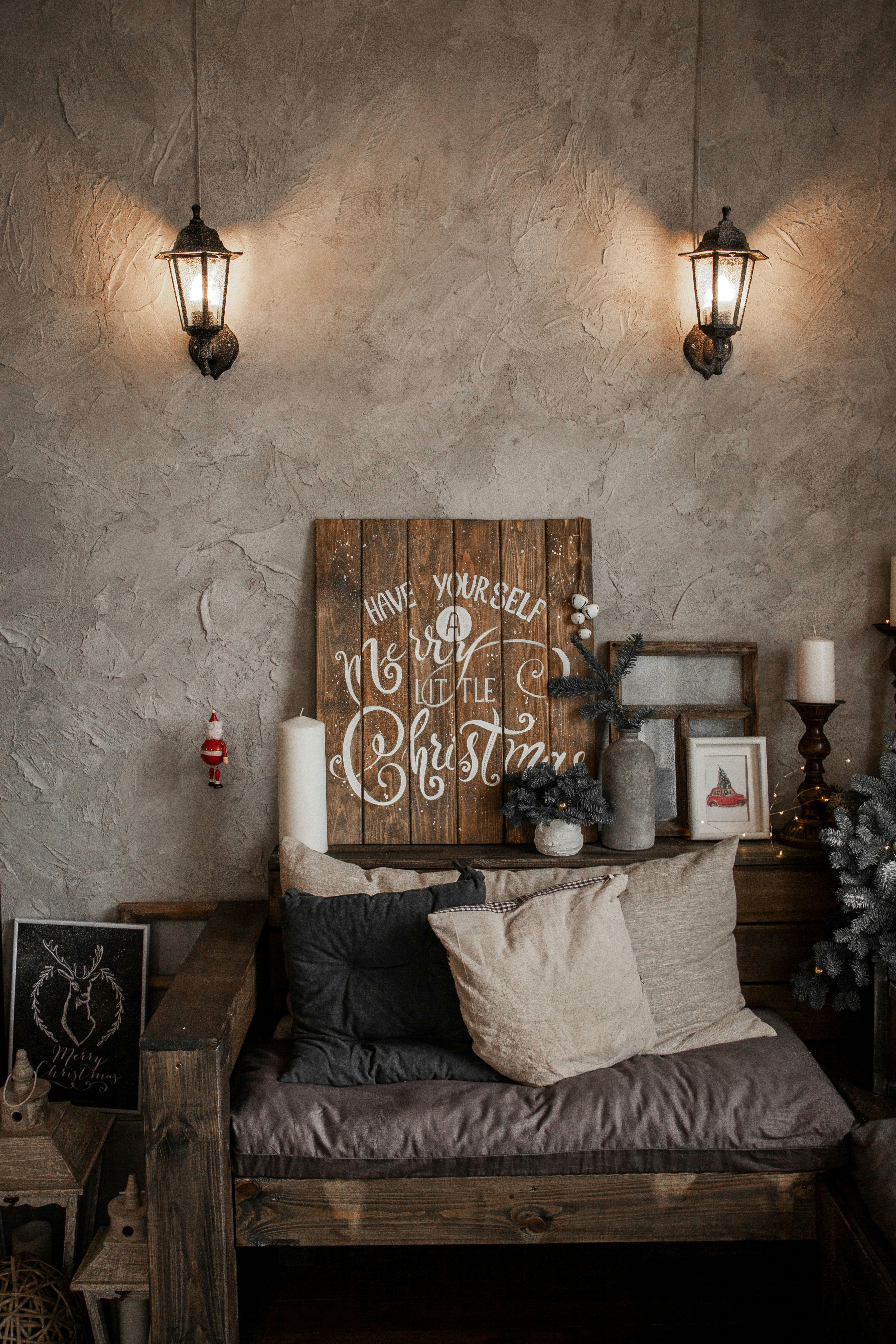 pillows on gray sofa near wall