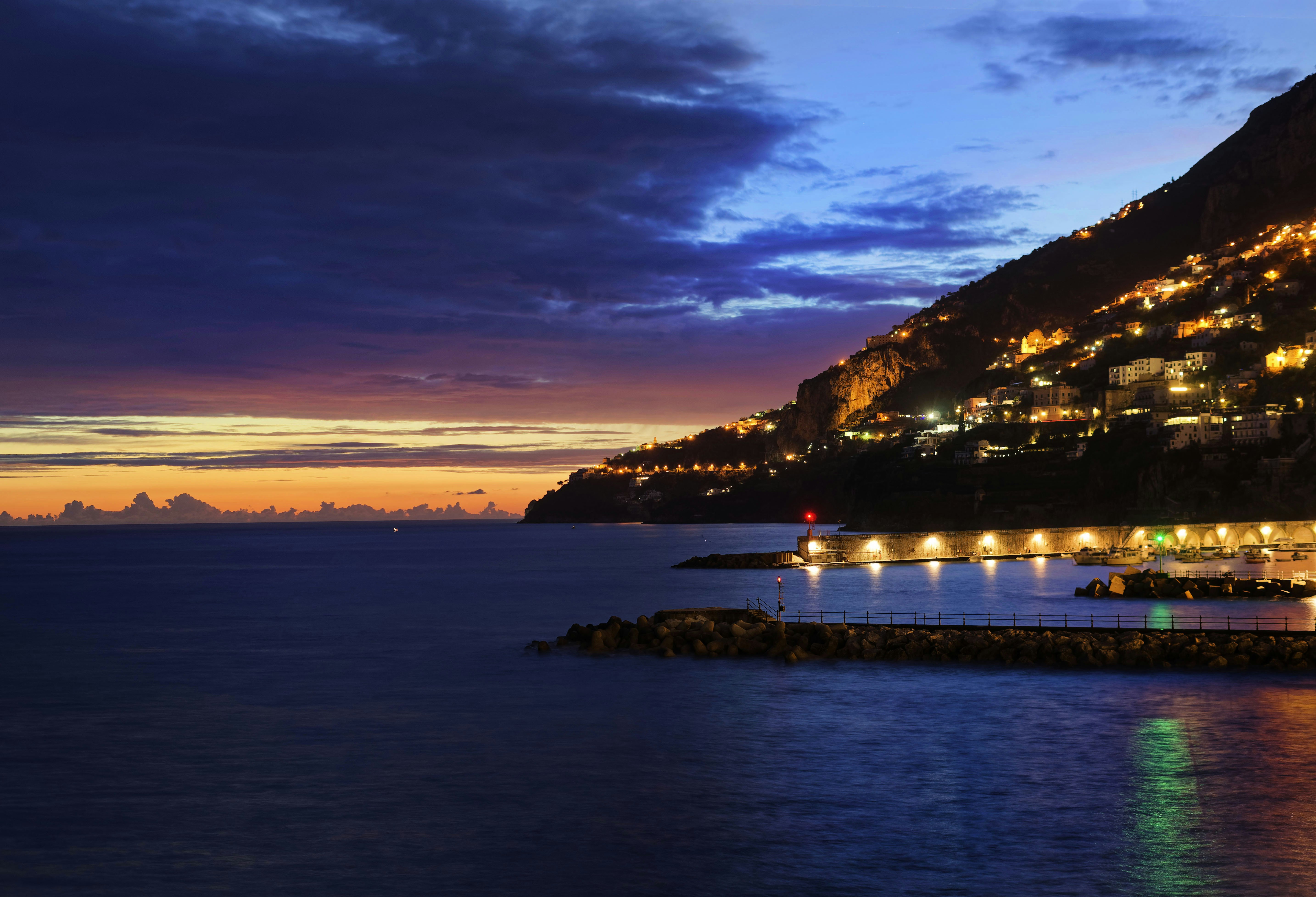 view photography of sea and mountain during dawn, Sunset in Amalfi