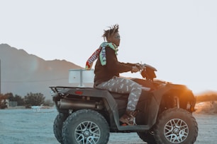 man riding ATV during daytime
